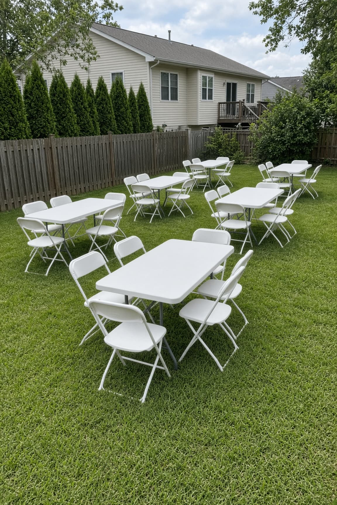 Colorful backyard party table with drinks and string lights